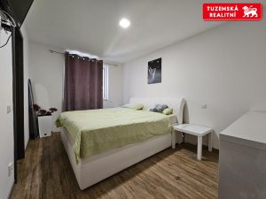 Zděná novostavba přízemního RD 4+kk s pergolou a zahradou v obci Hnojice u Šternberka.