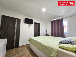 Zděná novostavba přízemního RD 4+kk s pergolou a zahradou v obci Hnojice u Šternberka.